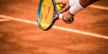 Detailed shot of a man serves at tennis game